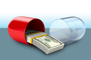 A drug capsule is split open with a bundle of $100 bills coming out
